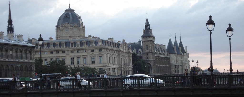 Photo of the Seine River flowing through Paris on a gloomy day.