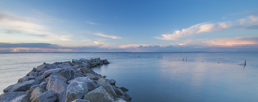 Photo of break water and blue sky