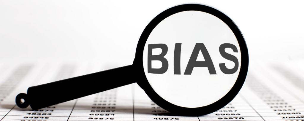 Photo of magnifying glass revealing bias in data