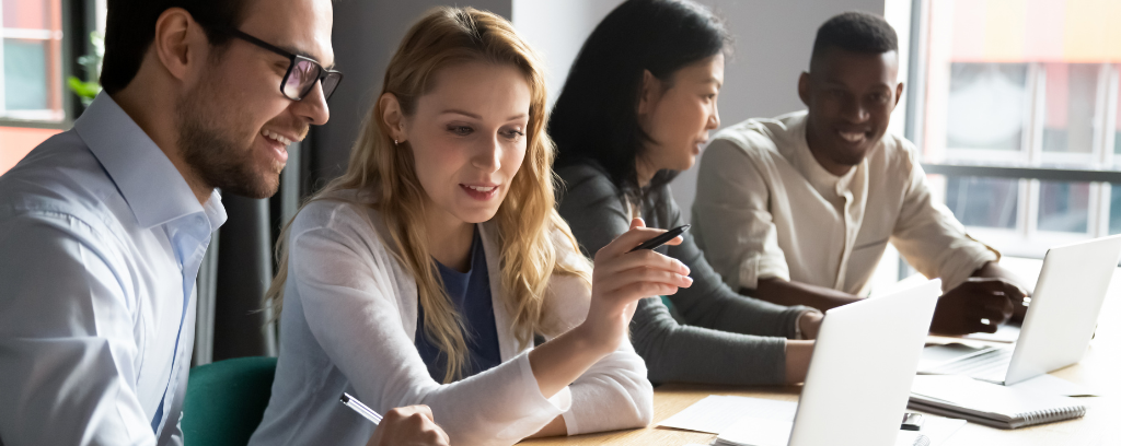 Photo of diverse group of employees working together effectively.