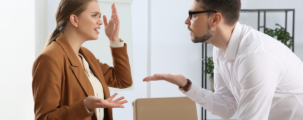 Photo of female employee expressing shock at boss' comment