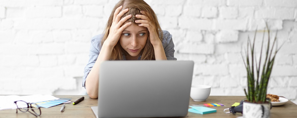Photo of frustrated employer facing worker misclassification penalties