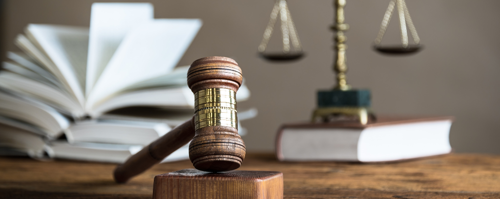 Photo of law books, gavel, and scales of justice