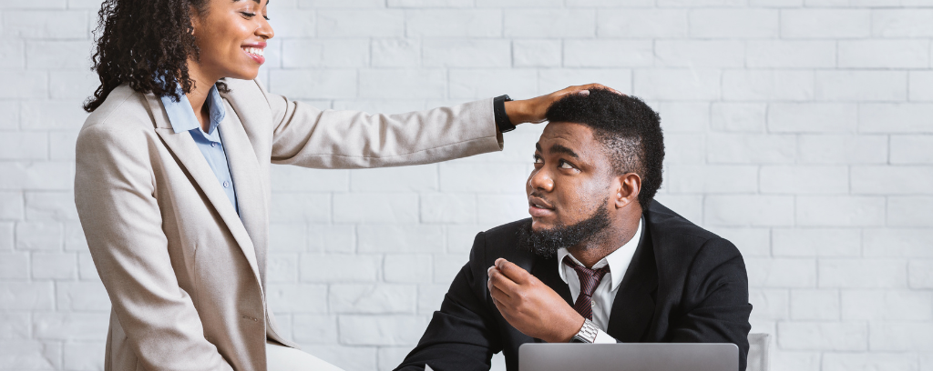 Photo of one employee demeaning another