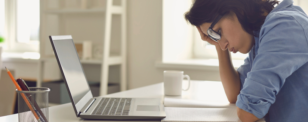 Photo of exhausted employer discovering a WC coverage error.