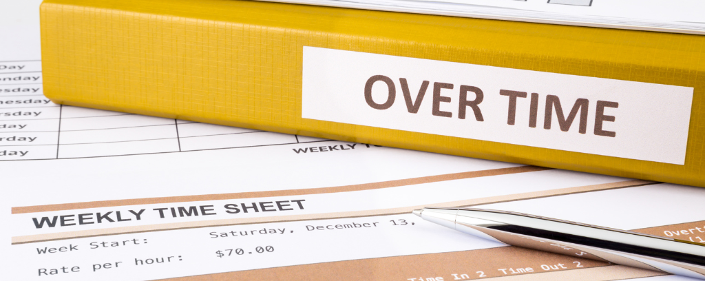 Photo of yellow binder labeled "overtime"