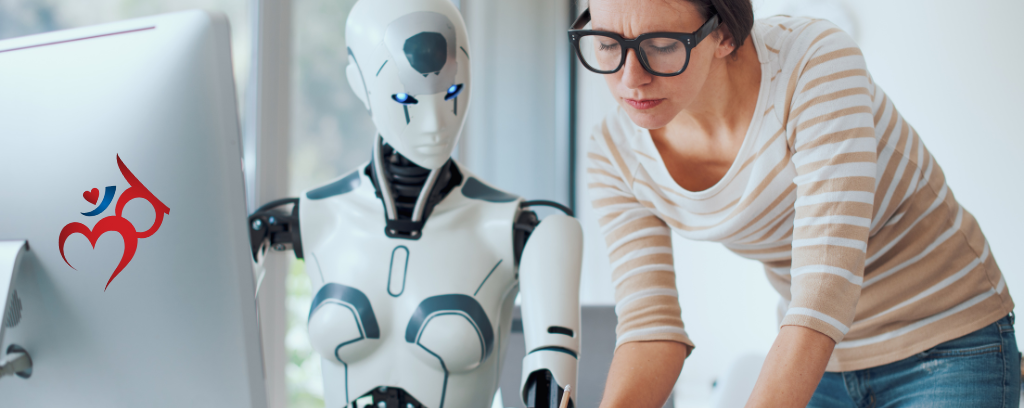 Photo of human supervising robot at computer desk