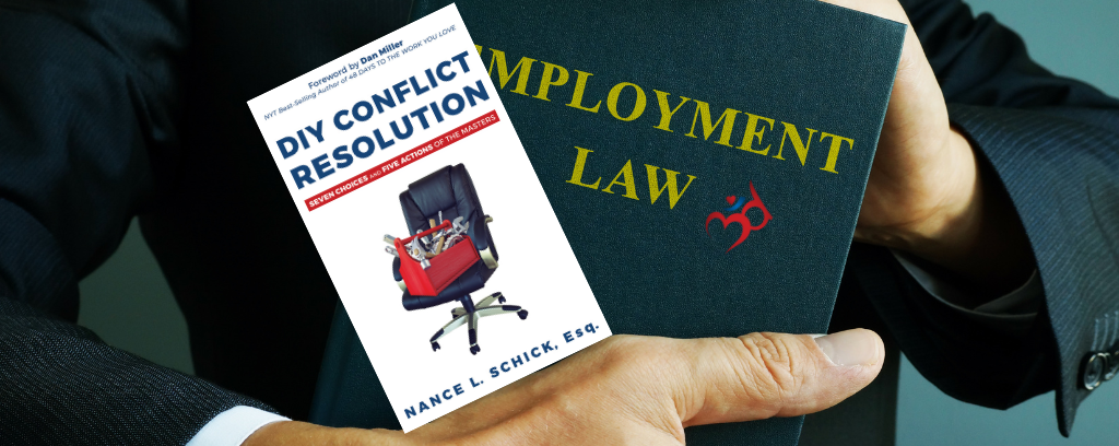 Photo of lawyer carrying employment law and DIY Conflict Resolution books